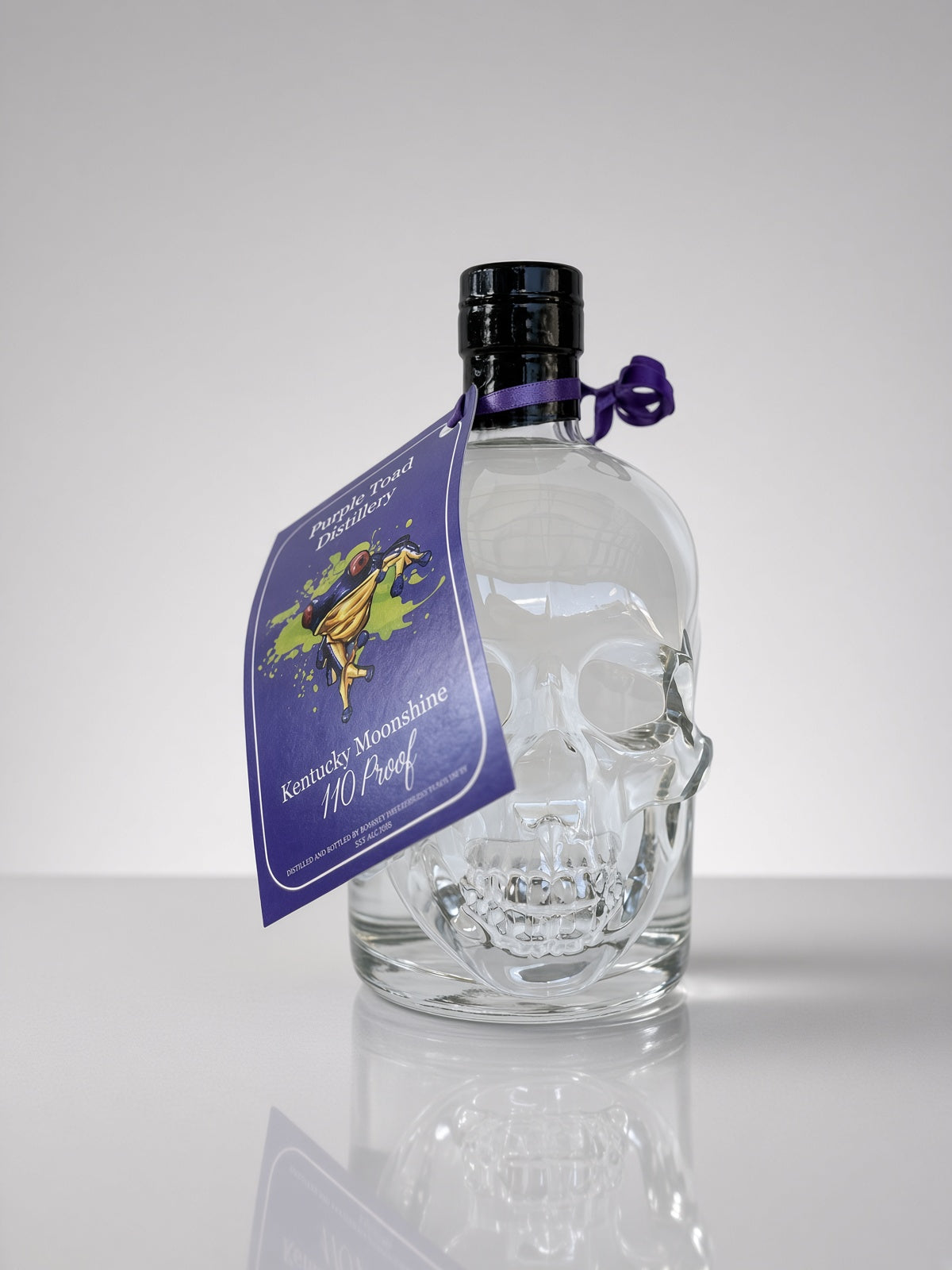 110 Proof Kentucky Moonshine in Skull Bottle — bottle and hang tag