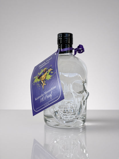 110 Proof Kentucky Moonshine in Skull Bottle — bottle and hang tag